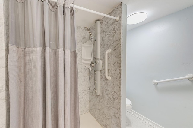 bathroom with toilet and a shower with shower curtain