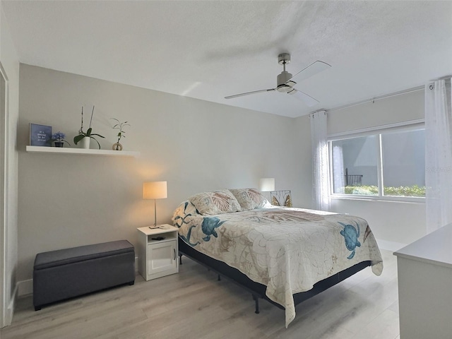 bedroom featuring ceiling fan and light hardwood / wood-style flooring