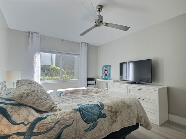 bedroom featuring ceiling fan and light hardwood / wood-style flooring