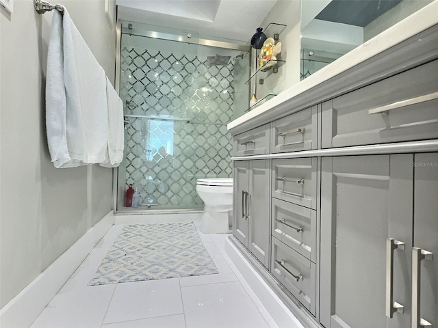 bathroom featuring vanity, toilet, and tile patterned flooring