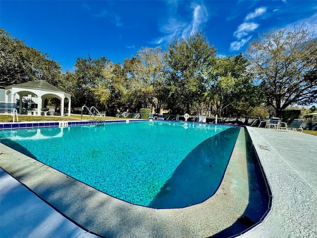 view of swimming pool featuring a gazebo