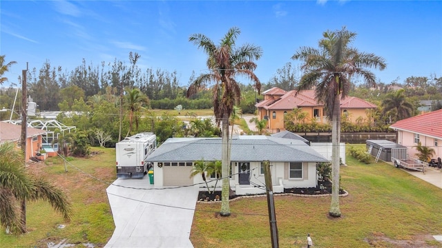 view of front of house featuring a garage and a front yard