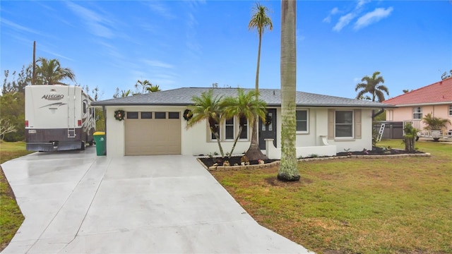 view of front of home with a garage and a front lawn