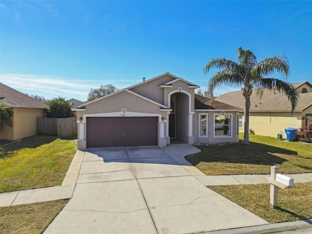 single story home featuring a garage and a front yard