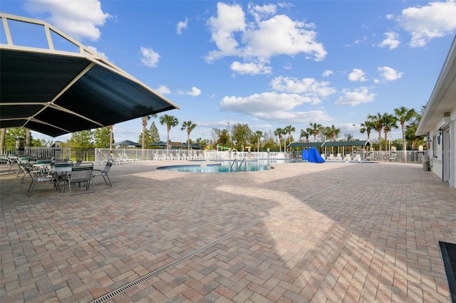 view of swimming pool with a patio area