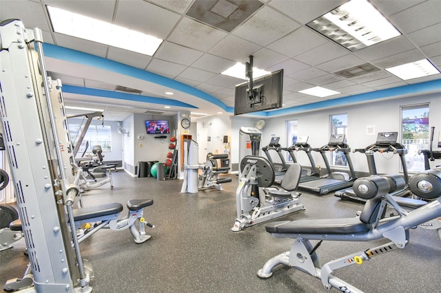 exercise room with a drop ceiling