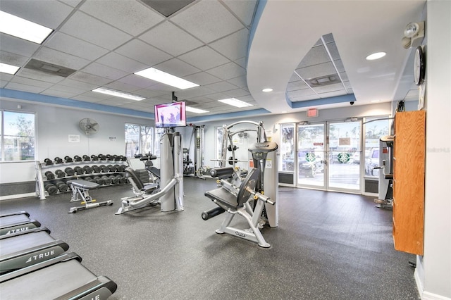 exercise room with a paneled ceiling