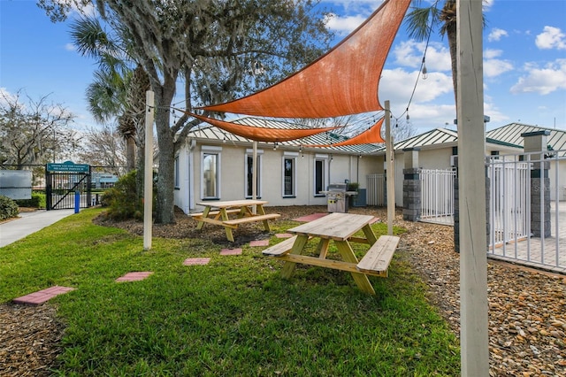 rear view of property with a yard