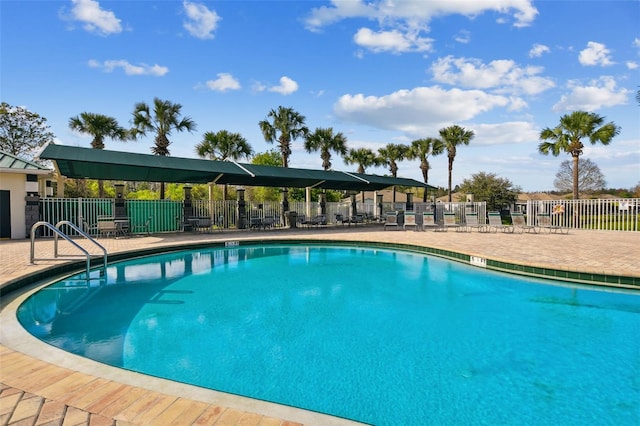 view of swimming pool featuring a patio area