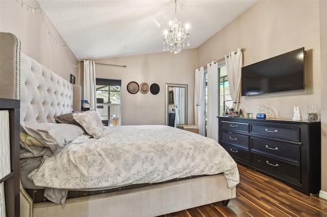 bedroom featuring lofted ceiling, dark hardwood / wood-style floors, and a notable chandelier