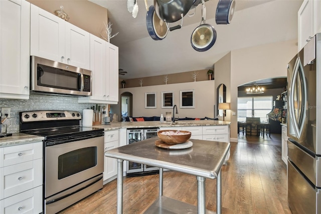 kitchen with white cabinetry, appliances with stainless steel finishes, and sink