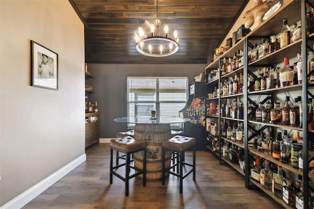 wine cellar featuring wood ceiling, dark wood-type flooring, and a chandelier