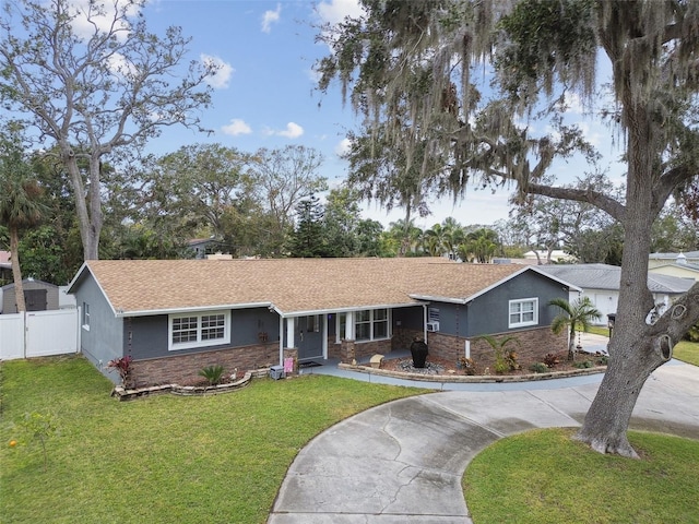 single story home with a front lawn