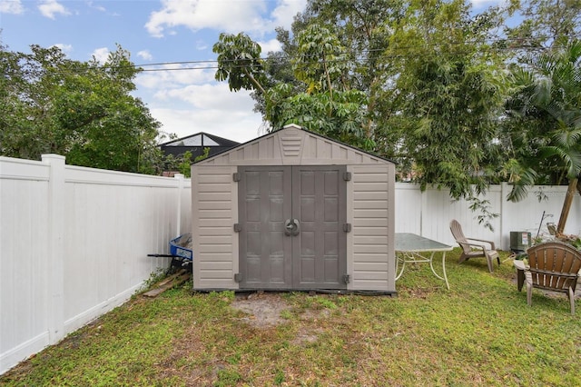 view of outdoor structure featuring a lawn