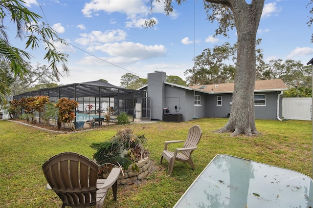 view of yard featuring a fenced in pool and a lanai