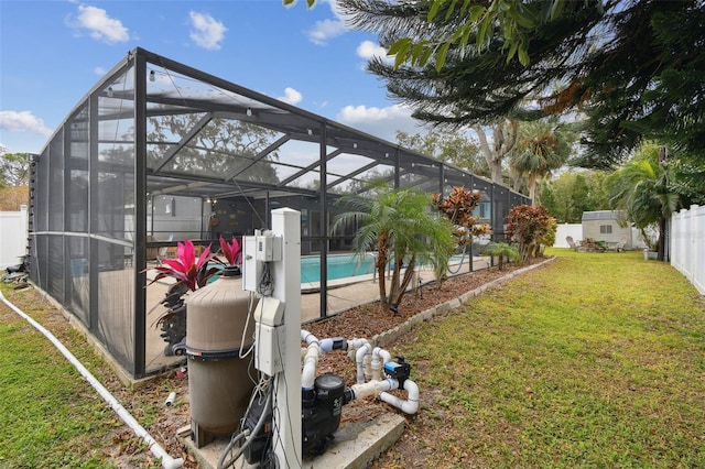 view of yard featuring a fenced in pool, a lanai, and a storage shed