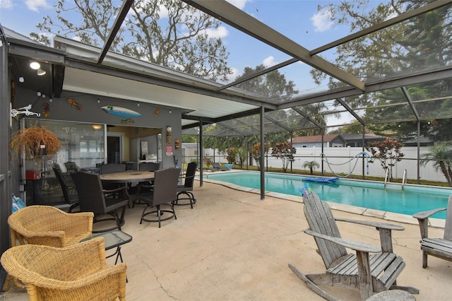 view of pool with a lanai and a patio