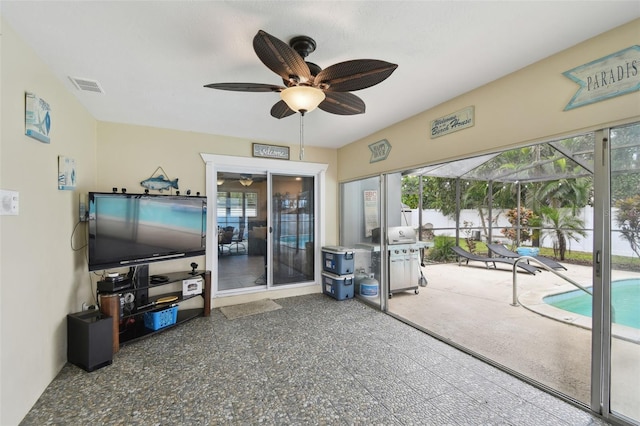 view of patio with a grill and glass enclosure