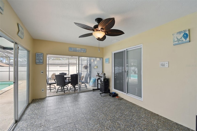 sunroom with ceiling fan