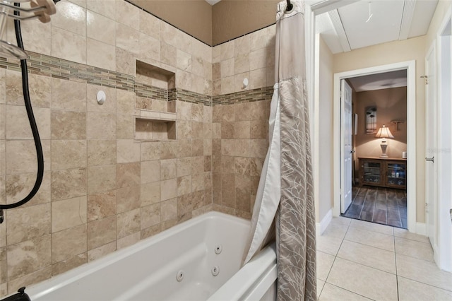 bathroom featuring shower / bath combination with curtain and tile patterned floors