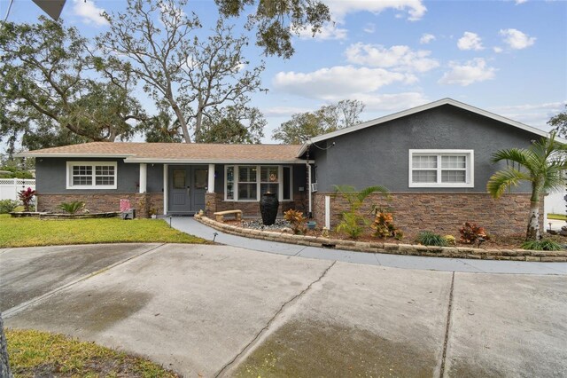 ranch-style house with a front lawn