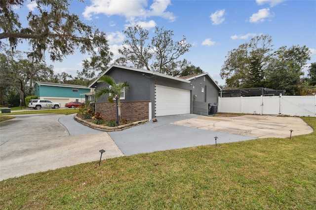 view of side of home with a garage and a yard