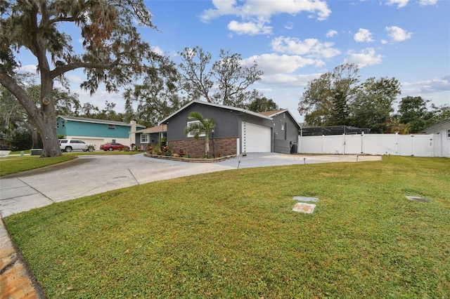 single story home featuring a garage and a front lawn