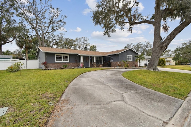 ranch-style home with a front yard