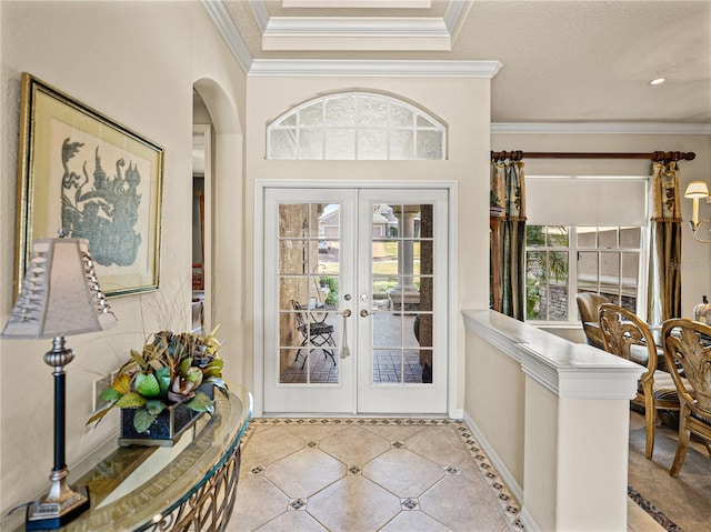 entrance foyer featuring arched walkways, light tile patterned floors, baseboards, french doors, and crown molding