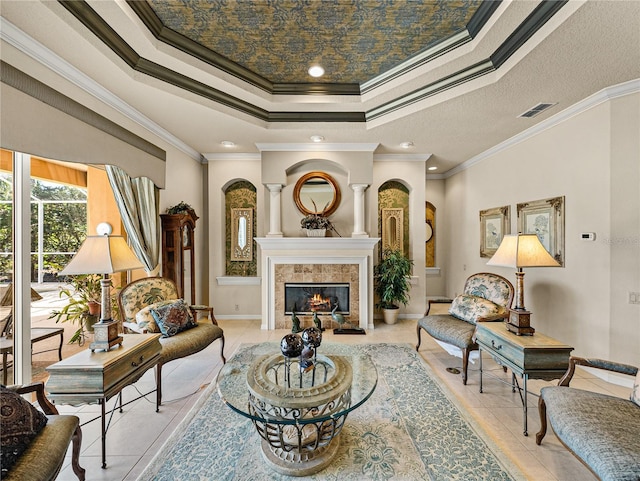 sitting room with visible vents, baseboards, a tray ceiling, a fireplace, and light tile patterned flooring