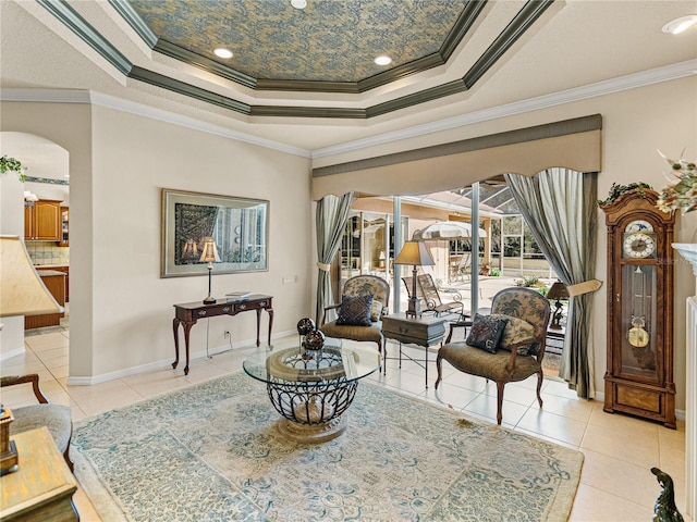 living area featuring arched walkways, a raised ceiling, light tile patterned flooring, and crown molding