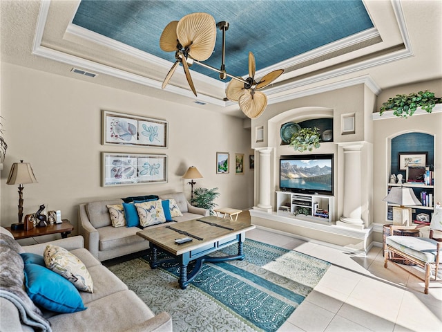 tiled living room with a tray ceiling, visible vents, and crown molding