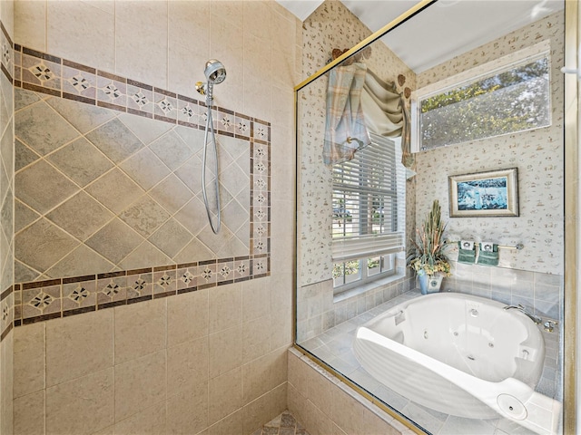 full bathroom featuring a whirlpool tub and a tile shower