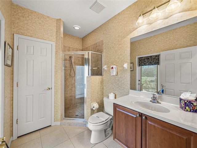 bathroom with visible vents, a shower stall, toilet, and tile patterned floors