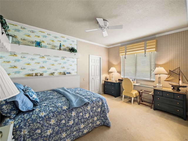 bedroom featuring crown molding, a textured ceiling, light carpet, and wallpapered walls