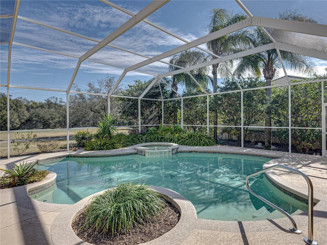 view of pool featuring a lanai and a pool with connected hot tub