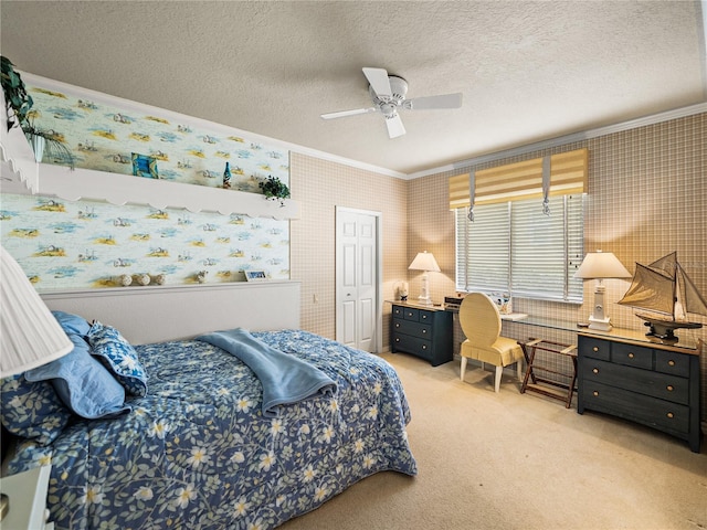 bedroom with a textured ceiling, light colored carpet, crown molding, and wallpapered walls