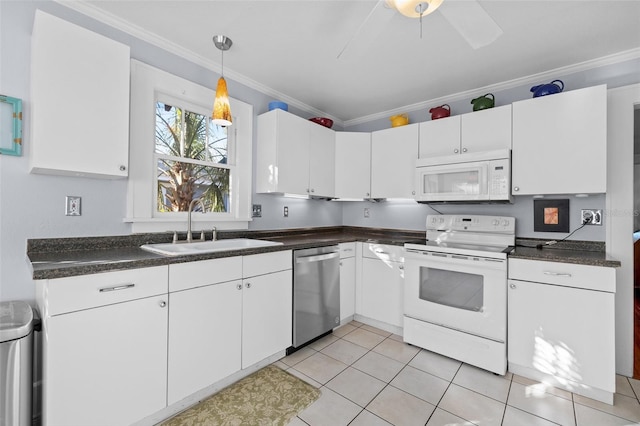 kitchen featuring white cabinetry, ornamental molding, sink, and white appliances