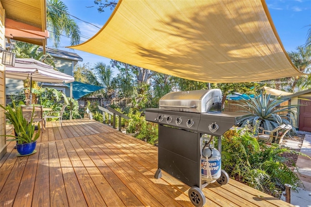 wooden terrace with a grill