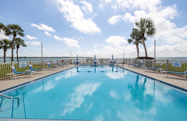 view of swimming pool featuring a patio area