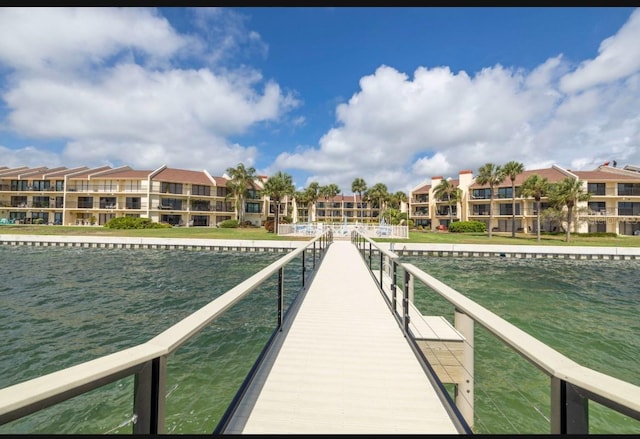 dock area featuring a water view