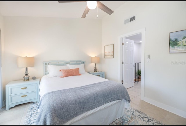 bedroom with ceiling fan and light tile patterned floors