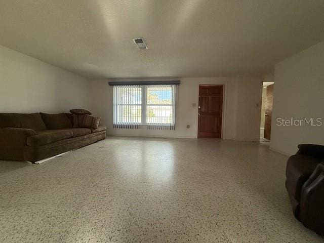 living room featuring a textured ceiling