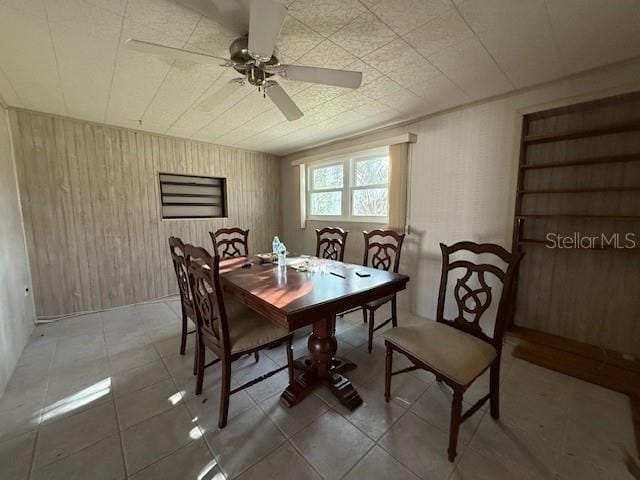 dining room with tile patterned flooring and ceiling fan