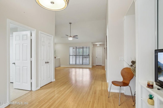 interior space featuring ceiling fan and light hardwood / wood-style flooring