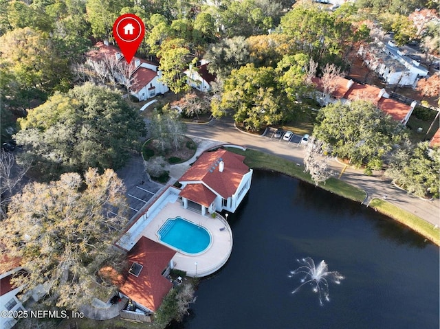 birds eye view of property with a water view