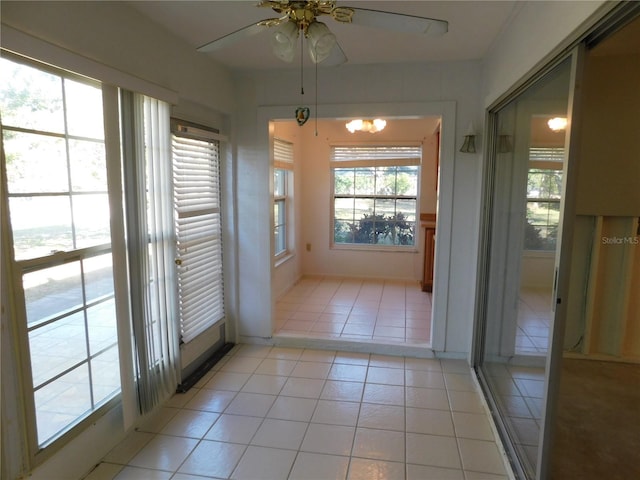 entryway featuring ceiling fan and light tile patterned floors