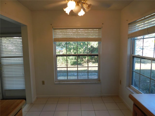 unfurnished room with light tile patterned floors