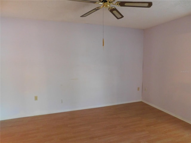 spare room featuring ceiling fan and light hardwood / wood-style flooring