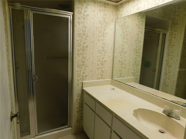 bathroom with vanity and walk in shower